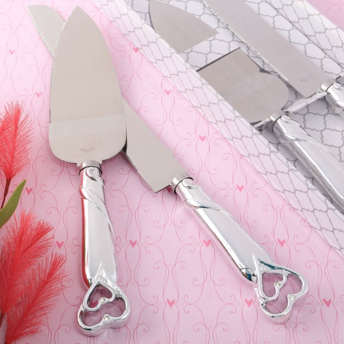 two piece  heart themed cake knife set with stainless steel blades and  shiny silver handles